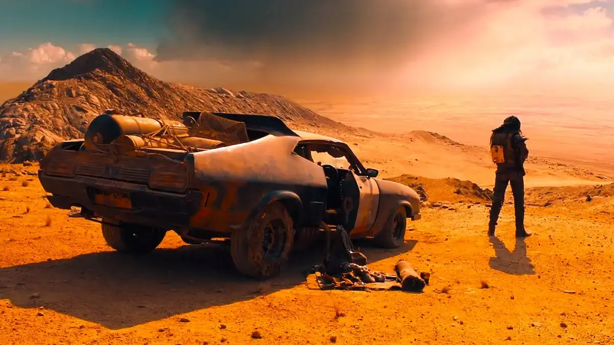 Mad Max next to the Interceptor, one of the Iconic Cars in Cinema.