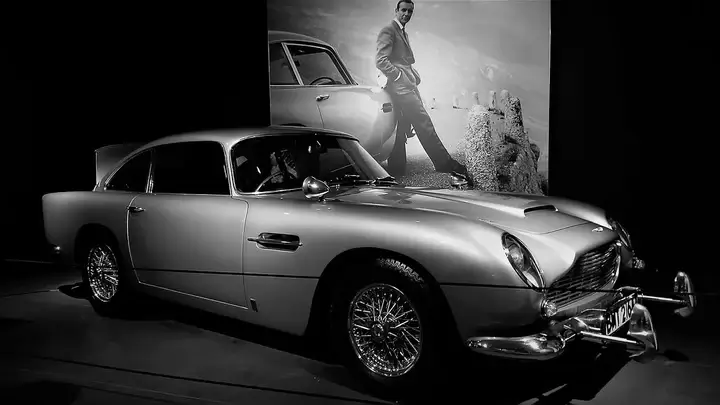 The Aston Martin DB5, James Bond’s vehicle, with hidden gadgets.