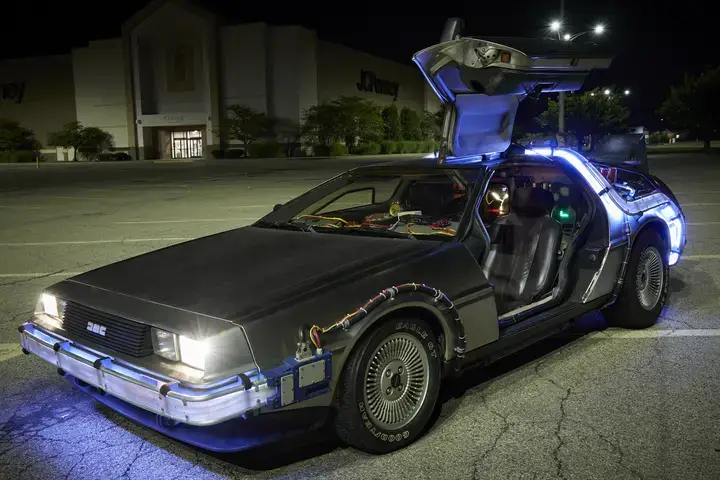 The DeLorean DMC-12, the vehicle from the Back to the Future films, with doors open.
