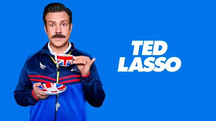 Ted Lasso, football coach, holding a cup of tea with the colors of the United Kingdom